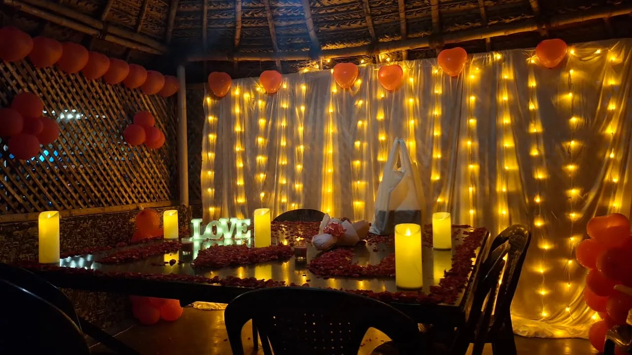 Surprise party decoration with balloons, candles, flower décor, and themed setup by Joyful Knots Events in Erode