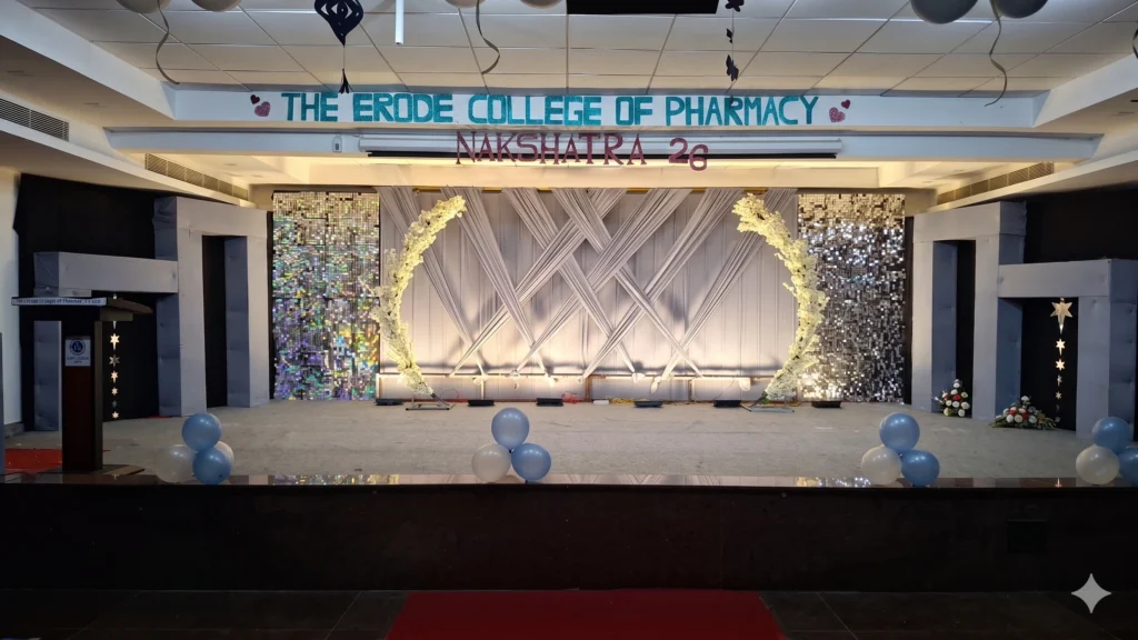 College culturals event setup with colorful stage decoration, lighting effects, welcome backdrop, and student celebration arrangements by Joyful Knots Events